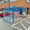 10 Space RAL Blue Oxford Cycle Shelter in outdoor carpark