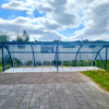 RAL Blue 20 Space Original Cycle Shelter outside with Sheffield Stands