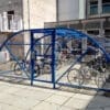 20 space original enclosure with blue metal framing and mesh door installed outside a residence