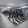 Semi Vertical Cycle Racks installed in an End of Trip Cycle Storage Facility in RAL Jet Black