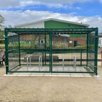 10 Space Cambridge Shelter with Polyester Powder Coating Framework and 10 Space Sheffield Stands installed outside