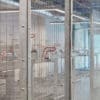 Close up of the two tier bike racks enclosed by the anti-climb mesh fencing.
