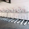 A row of Two Tier Cycle Racks inside of a commercial building