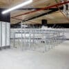 row of Two Tier Cycle Racks inside of a commercial building