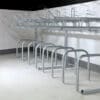 row of Two Tier Cycle Racks inside of a commercial building