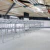 row of Two Tier Cycle Racks inside of a commercial building