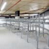 row of Two Tier Cycle Racks inside of a commercial building