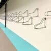 Vertical Bike Rack installed on a white brick wall in an underground bike storage facility