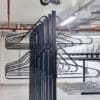 close up of solo vertical bike racks stored in underground cycle storage