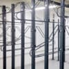 close up of solo vertical bike racks stored in underground cycle storage