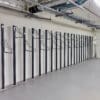 row of solo vertical bike racks stored in underground cycle storage