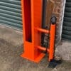 Public Maintenance Bike Stand in RAL colour orange installed outside of a commercial property with a bike pump and various bike repair tools