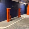 Public Maintenance Bike Stand in RAL colour orange installed outside of a commercial property with a bike pump and various bike repair tools