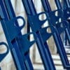 blue semi vertical bike rack locking hoops