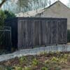 Greenwich Cycle Enclosure with wood cladding in RAL black installed at a residential property