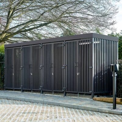 Greenwich Cycle Enclosure with wood cladding in RAL black installed at a residential property