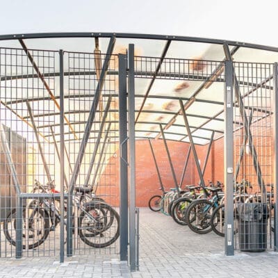 darlington shelter outside next to a brick with bikes locked on toastracks