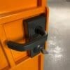 close up of locking system on a orange coloured cycle storage unit