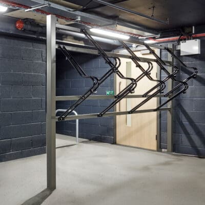 Premium Free Standing Vertical Bike Rack installed in an underground cycle storage facility