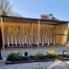 semi vertical bike racks installed in a wooden bike shelter