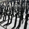 RAL Black Semi Vertical E-Bike Rack installed in underground cycle storage
