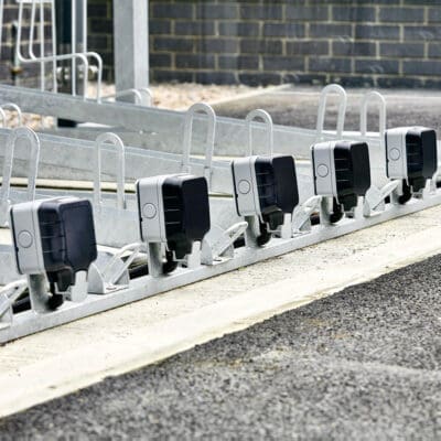 Two Tier E-Bike Racks installed in an out door bike shelter