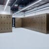 Several Camden Lockers installed in an underground cycle storage area which is focused on end of trip facilities.