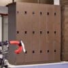 3X6 Row of Camden Lockers in a bronze colour installed in an underground cycle storage area for end of trip facilities