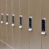 Close up of the Ojmar OCS Pro Lock on a row of Camden Lockers in colour bronze installed in a cycle storage facility