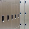 Close up of the Ojmar OCS Pro Lock on a row of Camden Lockers in colour bronze installed in a cycle storage facility