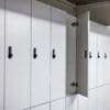 Camden Clothing Lockers with one door open, with white laminate doors and Digi Code Lock installed in an underground bike storage facility.