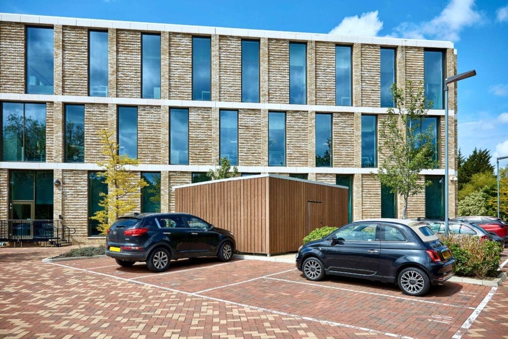image of an amazon eco enclosure with composite cladding installed in the carpark of a commercial building