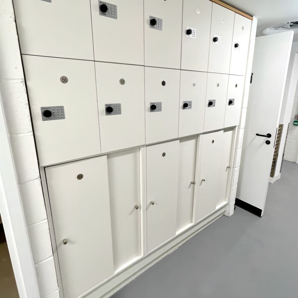 Hackney Accessible Lockers in white installed in an underground cycle storage end of trip facility