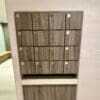 Islington Locker with wood panelling and gold accents installed in an end of trip cycle storage facility