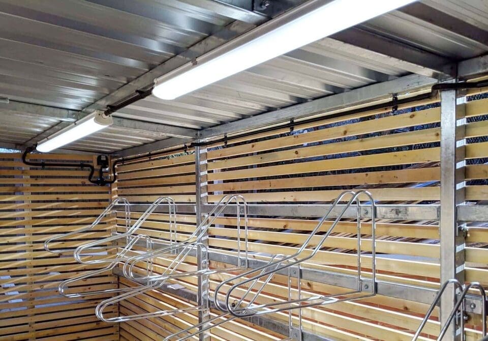 PIR lihting in a cycle shelter, vertical racks also in shot