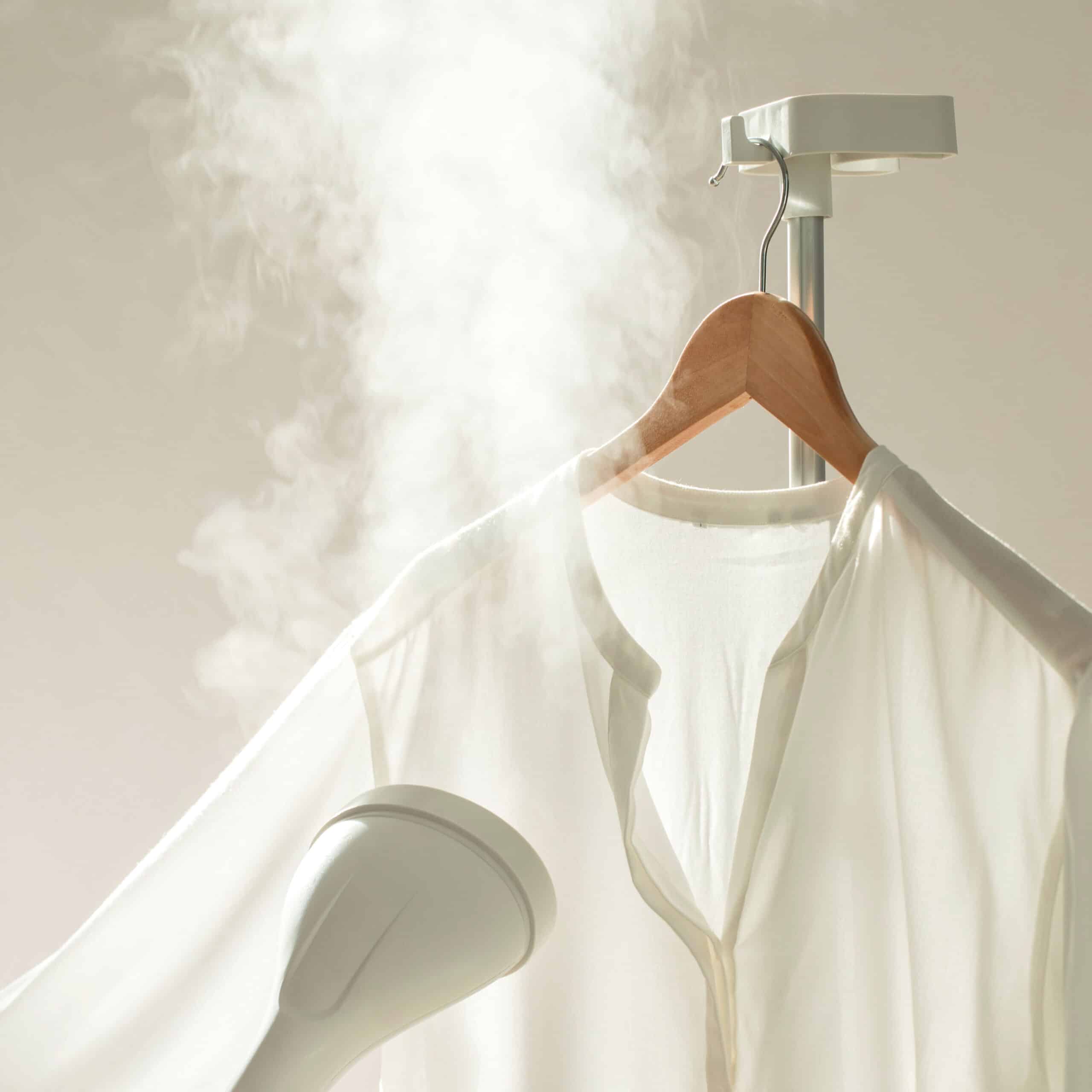 Clothes steaming locker render showing a white button-up short being steamed