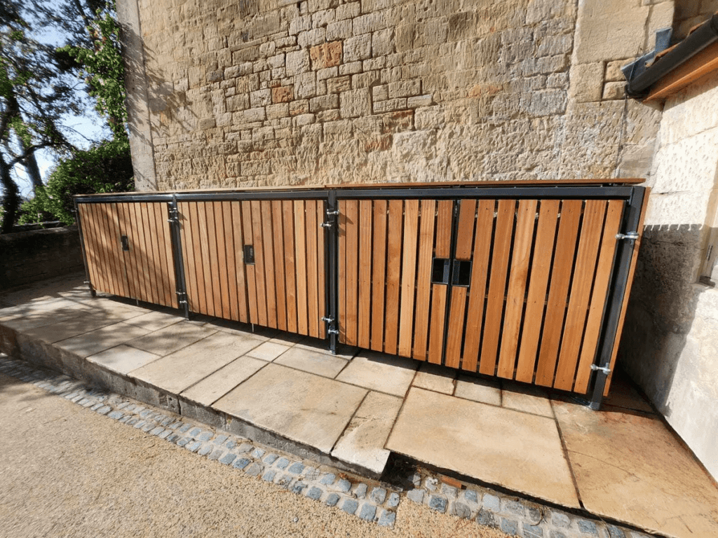 wood cladding premium amazon cycle locker outside on a residential property