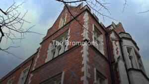 The Bromptons Estate featuring an old brick house and trees 