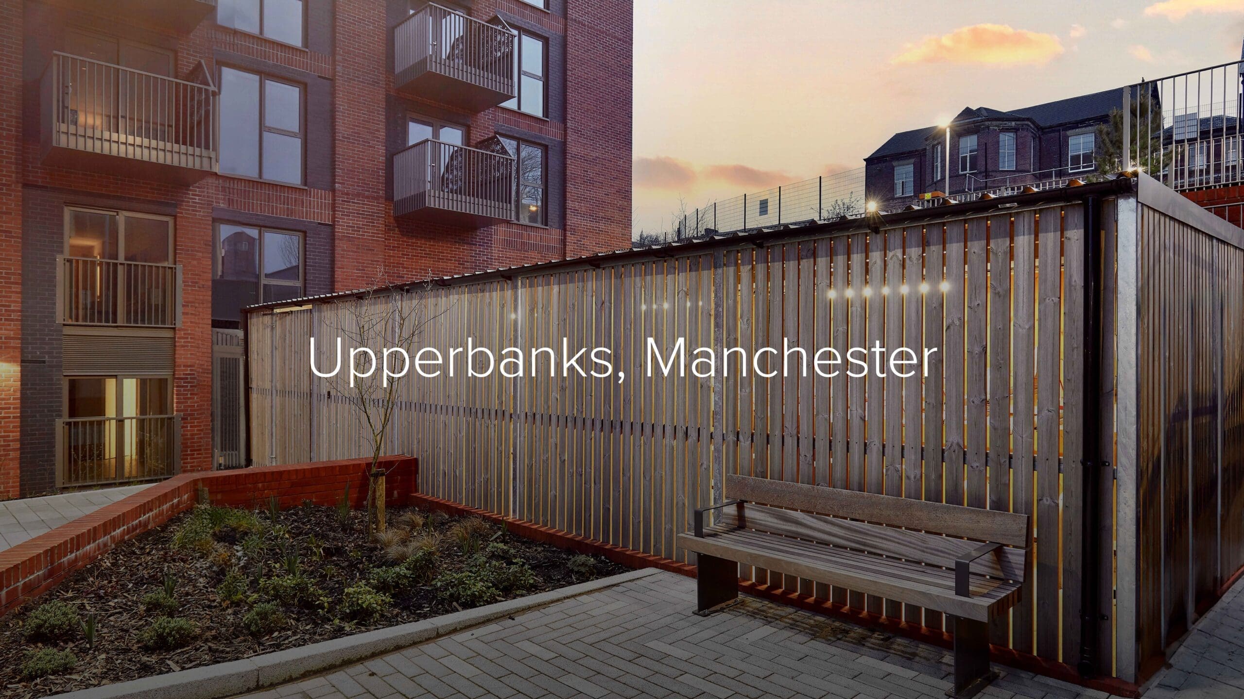 Upperbanks, Manchester – timber-clad Amazon Eco cycle enclosure at sunset