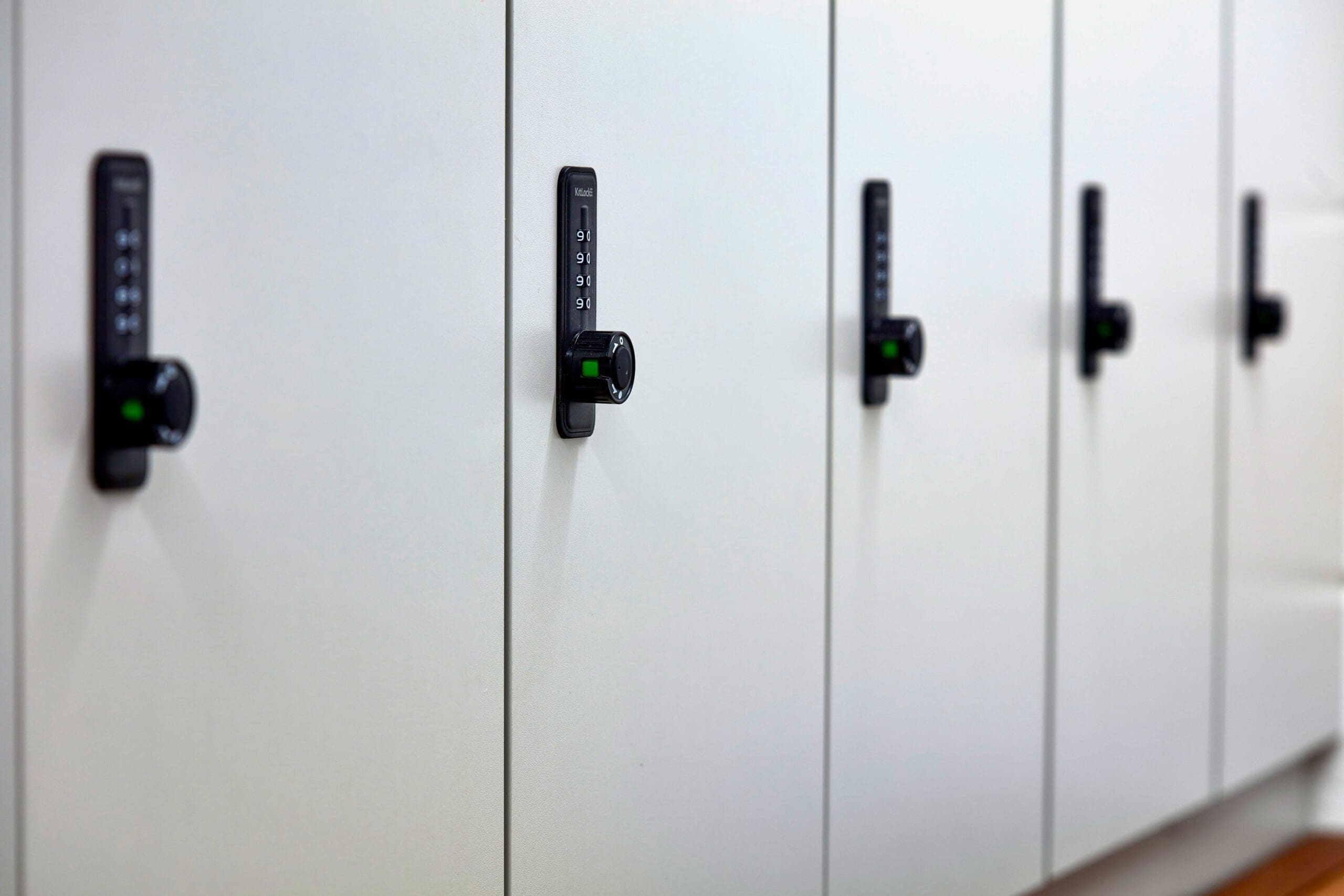 end of trip white hardwood clothing locker with black locks