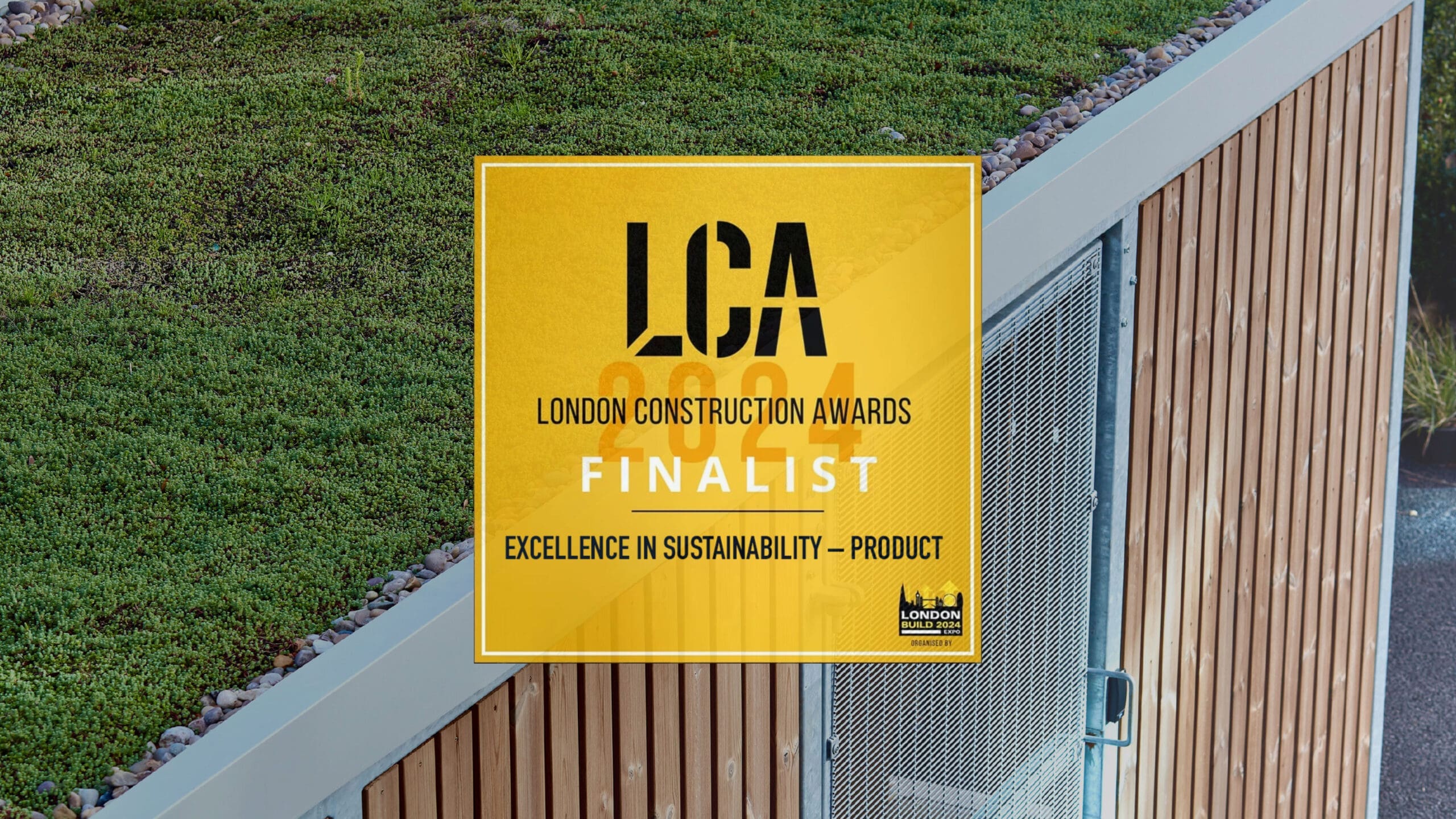 London Construction Awards Logo and Category overlayed on top of our our Premium Amazon Semi Vertical Enclosure with Sedum Roofing