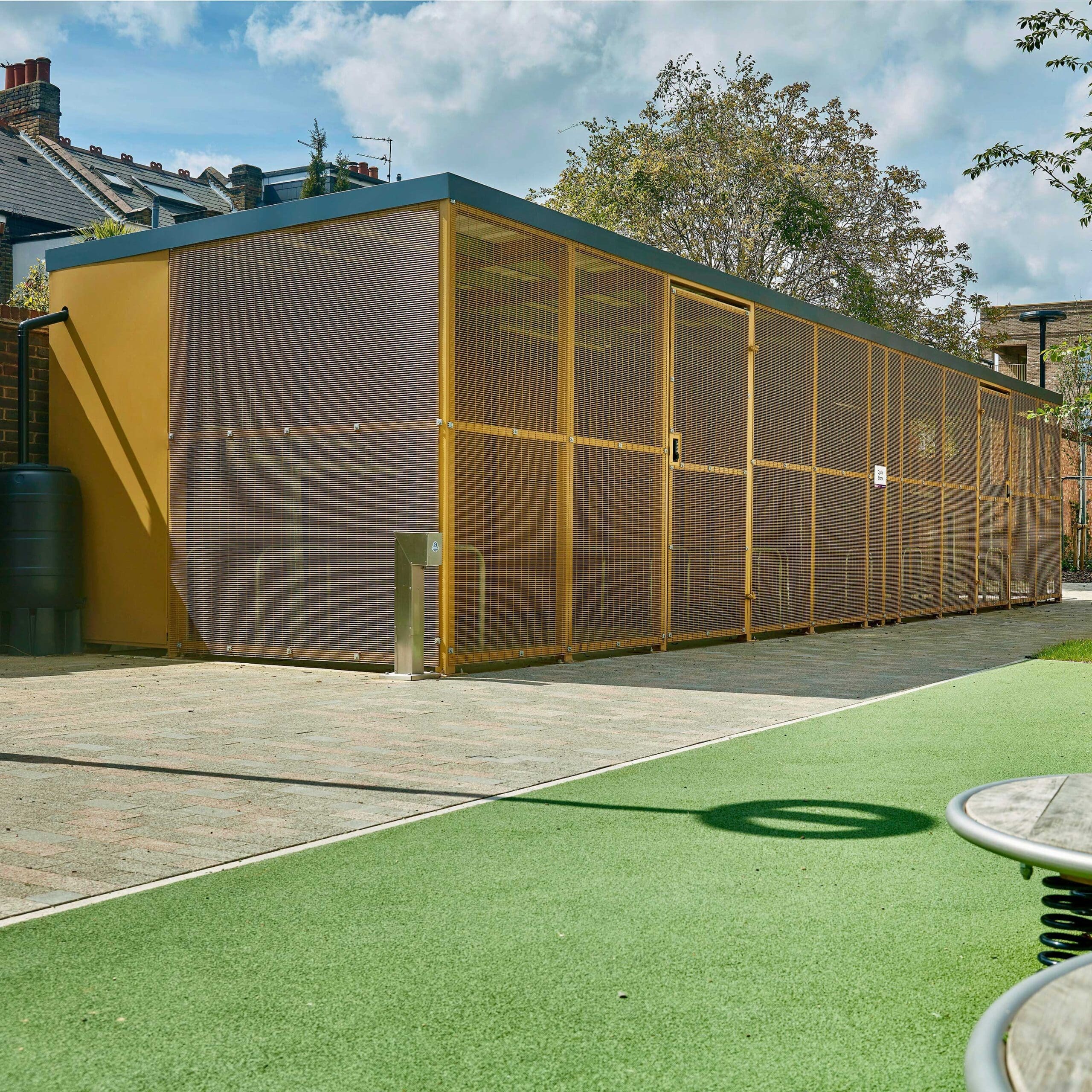 The Eastbrook Shelter with polyester powder coating and mesh fencing installed at The Everglades in Hounslow, London residential development