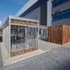 Close up of the Habitat Panel Shelter installed externally in a commercial setting