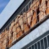 Close up of the habitat panel shelter with mesh cladding installed in an commercial setting