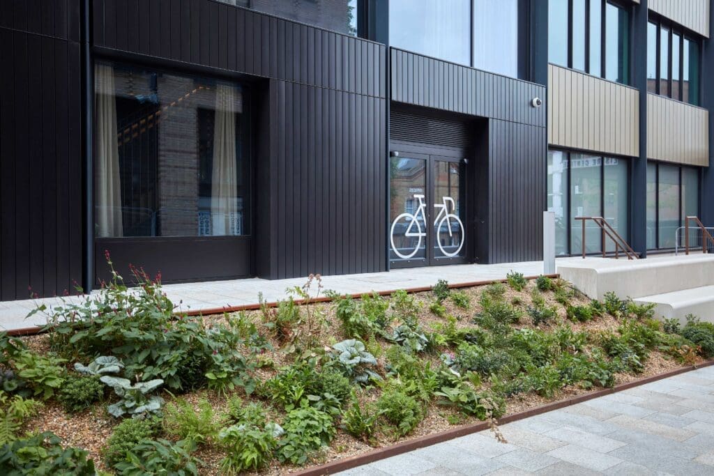 Bike Storage facility installed in a commercial building with a cycle motif on the door