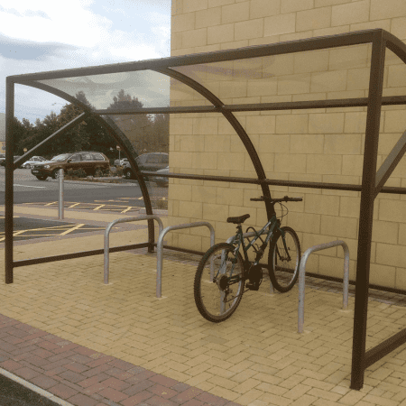 10 space original cycle shelter RAL colour green with 1 bike stored on Sheffield stand