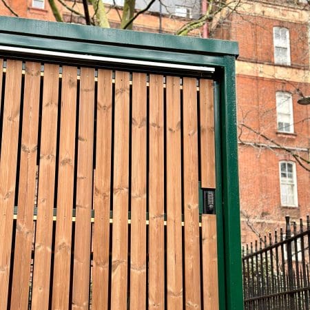 10 Space Amazon Eco Shelter installed outside of a residential property with timber cladding and green fascia