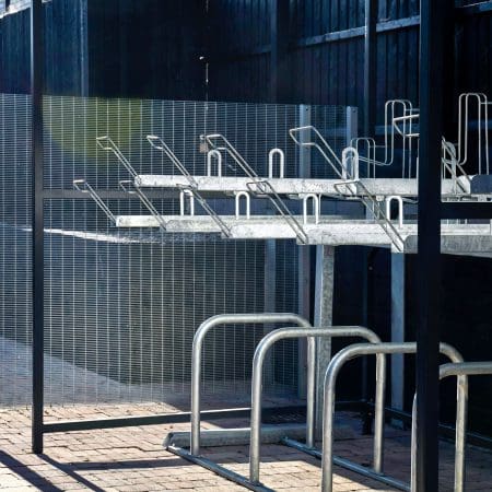 Close up of Two Tier Racks and Sheffield Stands installed in a Cambridge Two Tier Shelter