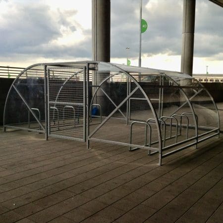 metal 20 space original enclosure with galvanised metal framing and mesh door installed in a commercial carpark