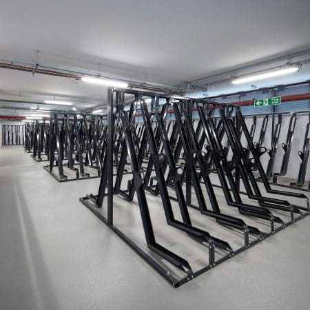 Semi Vertical Cycle Racks installed in an End of Trip Cycle Storage Facility in RAL Jet Black